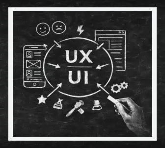 Person writing on chalkboard with UX and UI symbols